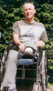 Co LeDahu proudly showing his stump in the wheelchair